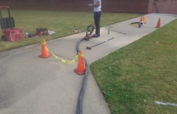 lifting the sidewalk for it to drain properly