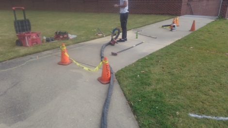 lifting the sidewalk for it to drain properly