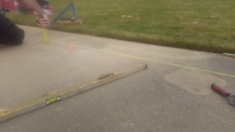 lifting the sidewalk for it to drain properly