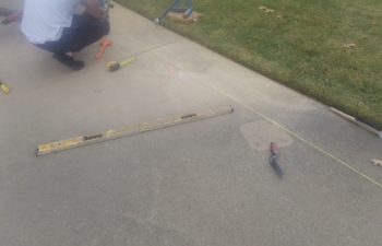 lifting the sidewalk for it to drain properly