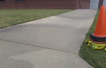 lifting the sidewalk for it to drain properly