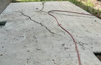 Before: When the base is not properly compacted before the concrete is poured, the patio will buckle and crack as the ground shifts.