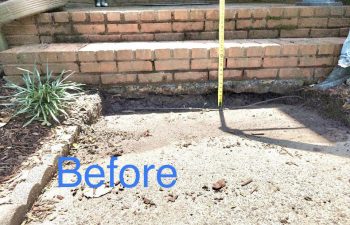 Before: This concrete slab sank so much where it meets the front porch stairs that a gap appeared, and mud built up from pooling water. You can see from the tape that the height is way out of code!