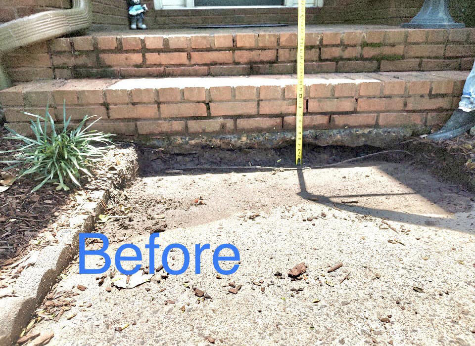 Before: This concrete slab sank so much where it meets the front porch stairs that a gap appeared, and mud built up from pooling water. You can see from the tape that the height is way out of code!