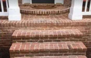 damaged brick steps in a front door
