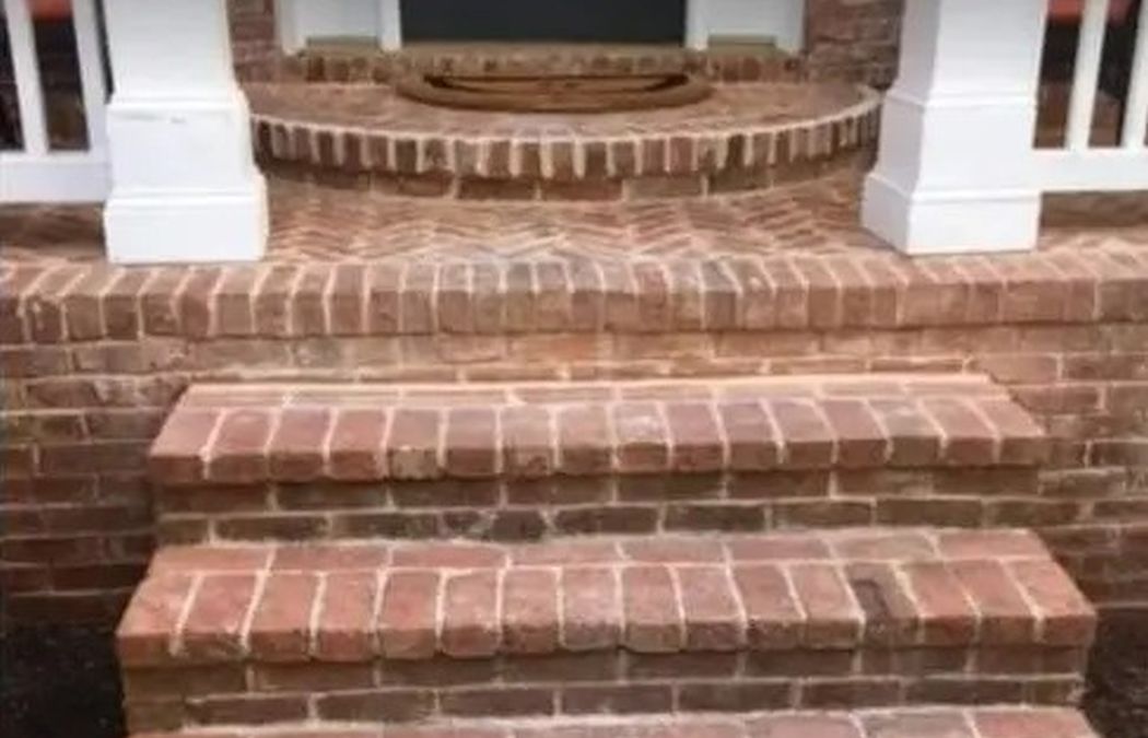 damaged brick steps in a front door