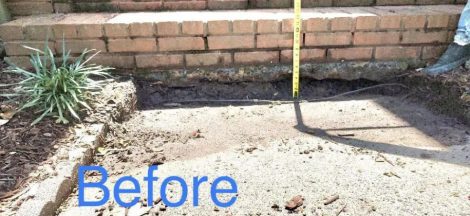 Before: This concrete slab sank so much where it meets the front porch stairs that a gap appeared, and mud built up from pooling water. You can see from the tape that the height is way out of code!